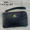Cartera de mano COACH en cuero